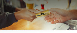 handing 365 rewards card to bartender
