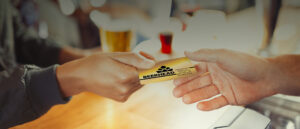 handing 365 rewards card to bartender